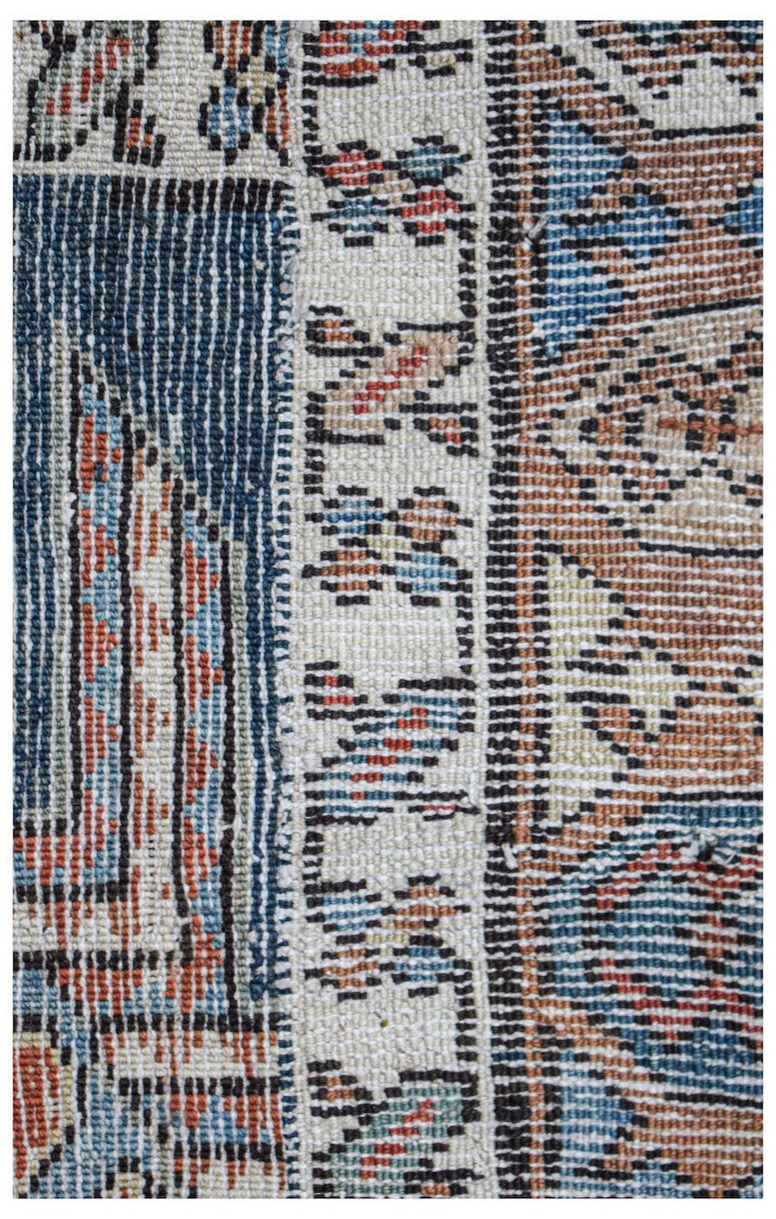 A close-up of a vintage Caucasian Shirvan runner featuring intricate geometric patterns in wool.