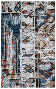 A close-up of a vintage Caucasian Shirvan runner featuring intricate geometric patterns in wool.