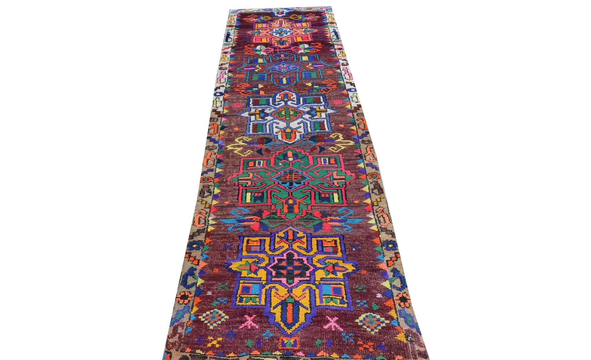 Vintage Kurdish Herki runner with colorful geometric patterns.