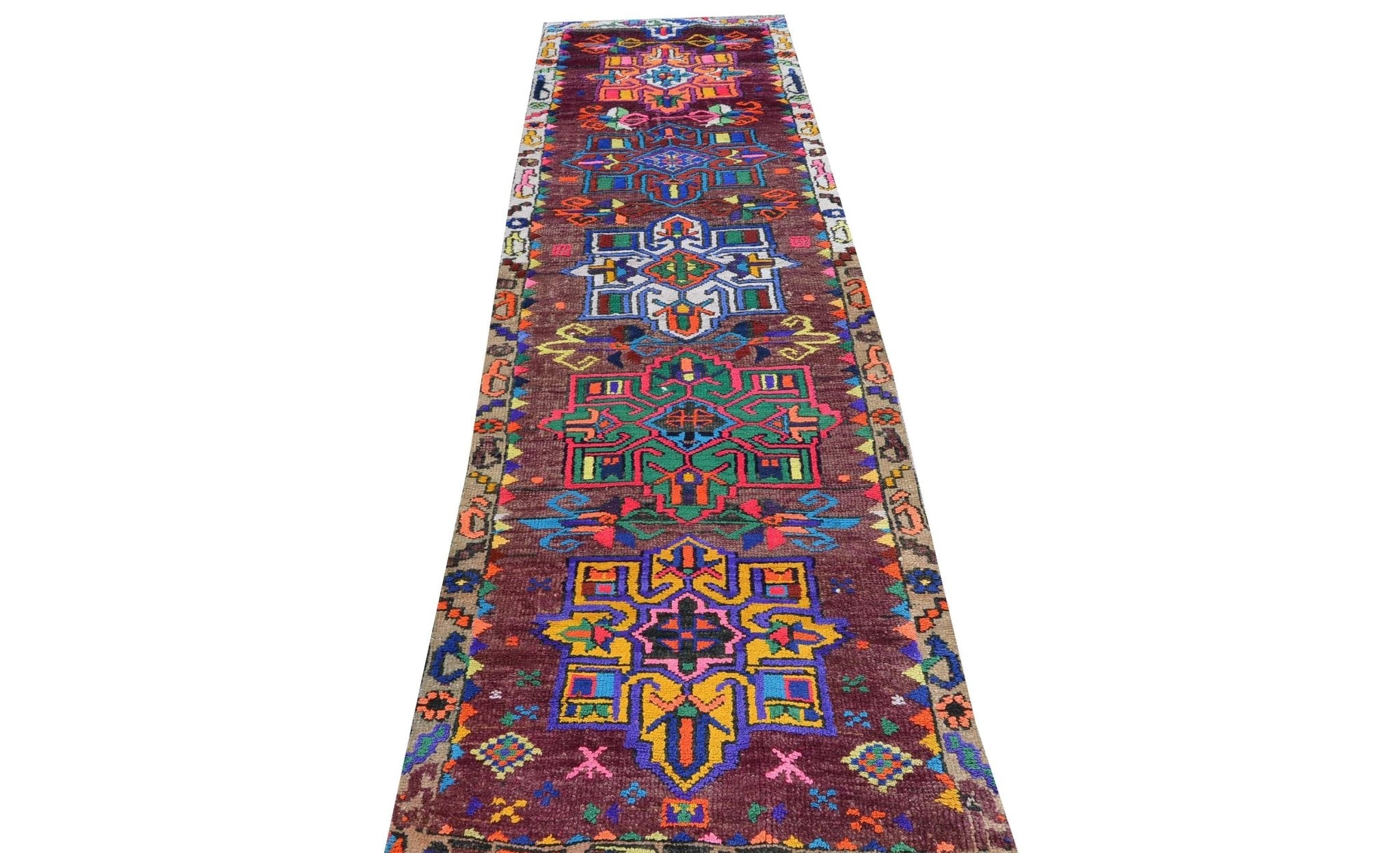 Vintage Kurdish Herki runner with colorful geometric patterns.