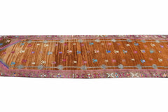 Vintage Kurdish Herki runner with tribal motifs in brown and pink.