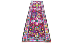A vintage Kurdish Herki runner featuring vibrant tribal motifs in wool and neon nylon.