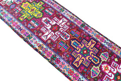 A vintage Kurdish Herki runner featuring vibrant tribal motifs in wool and neon nylon.