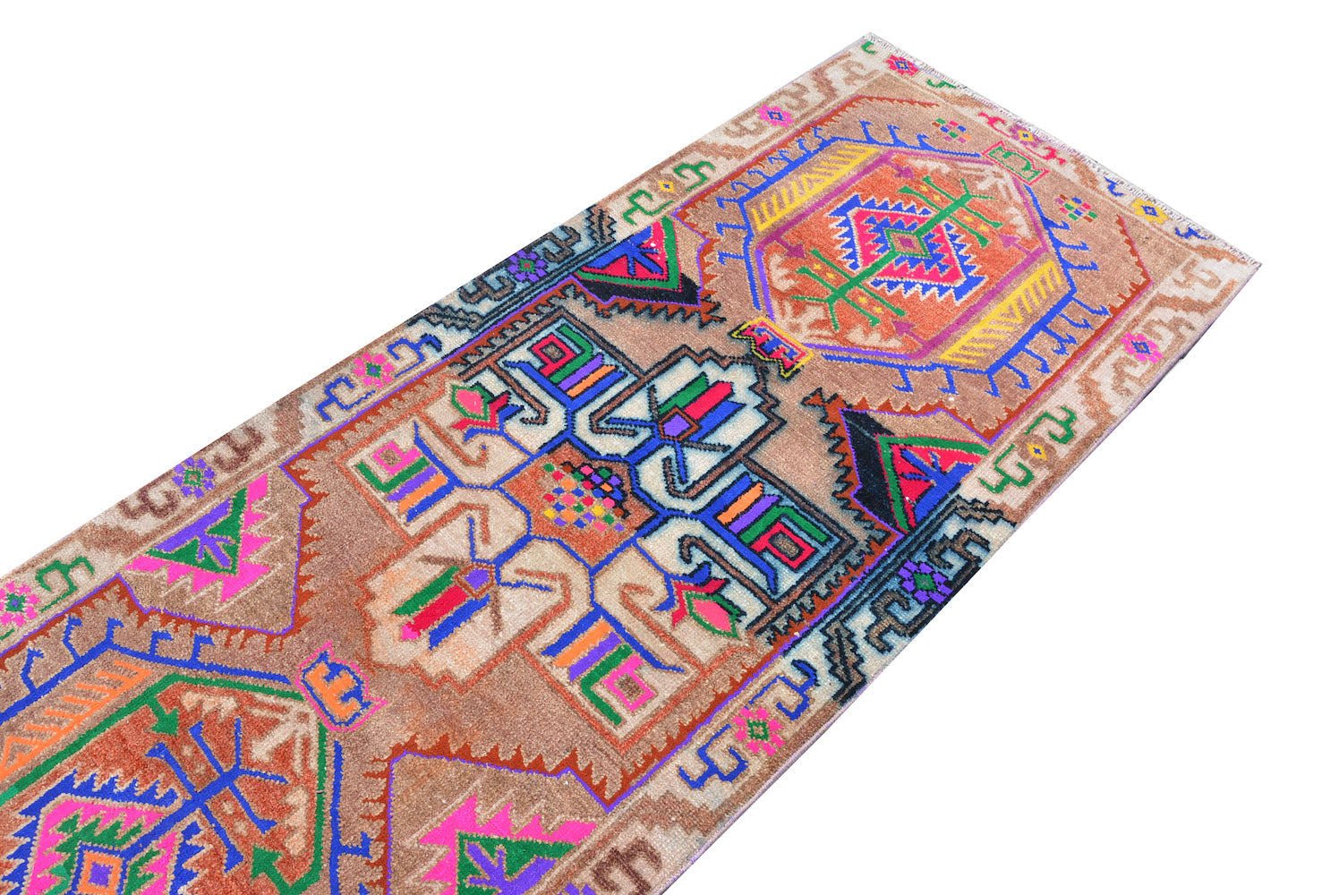 A vintage Kurdish Herki runner featuring tribal motifs in vibrant neon colors on a wool base.