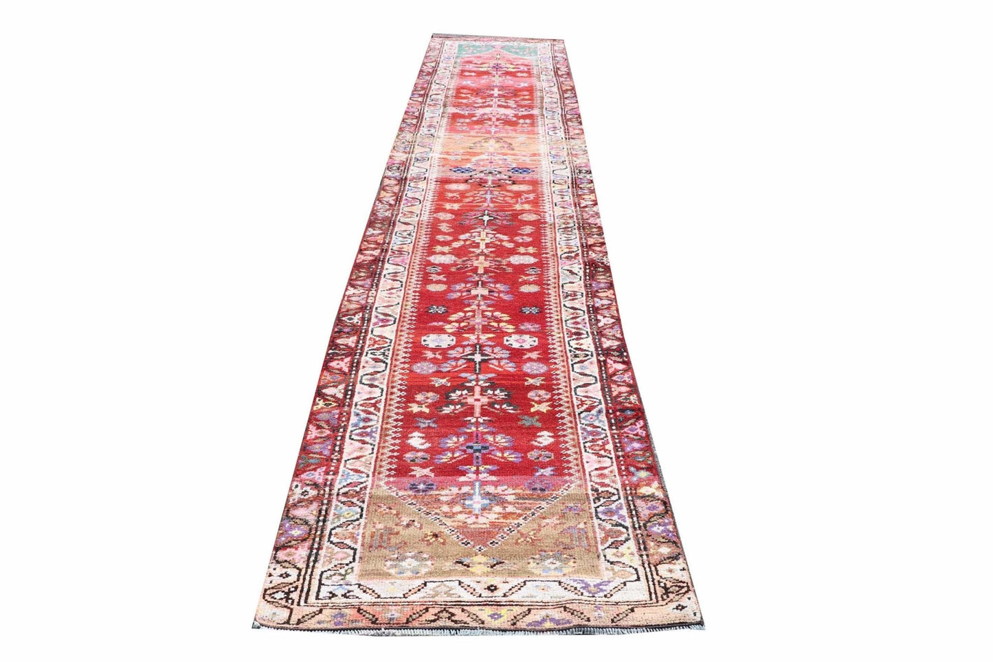 Vintage Kurdish Herki runner with red, pink, and tan tribal patterns.