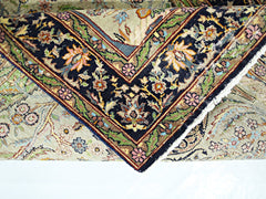 A vintage handmade Persian prayer rug featuring intricate floral patterns and a dark border.