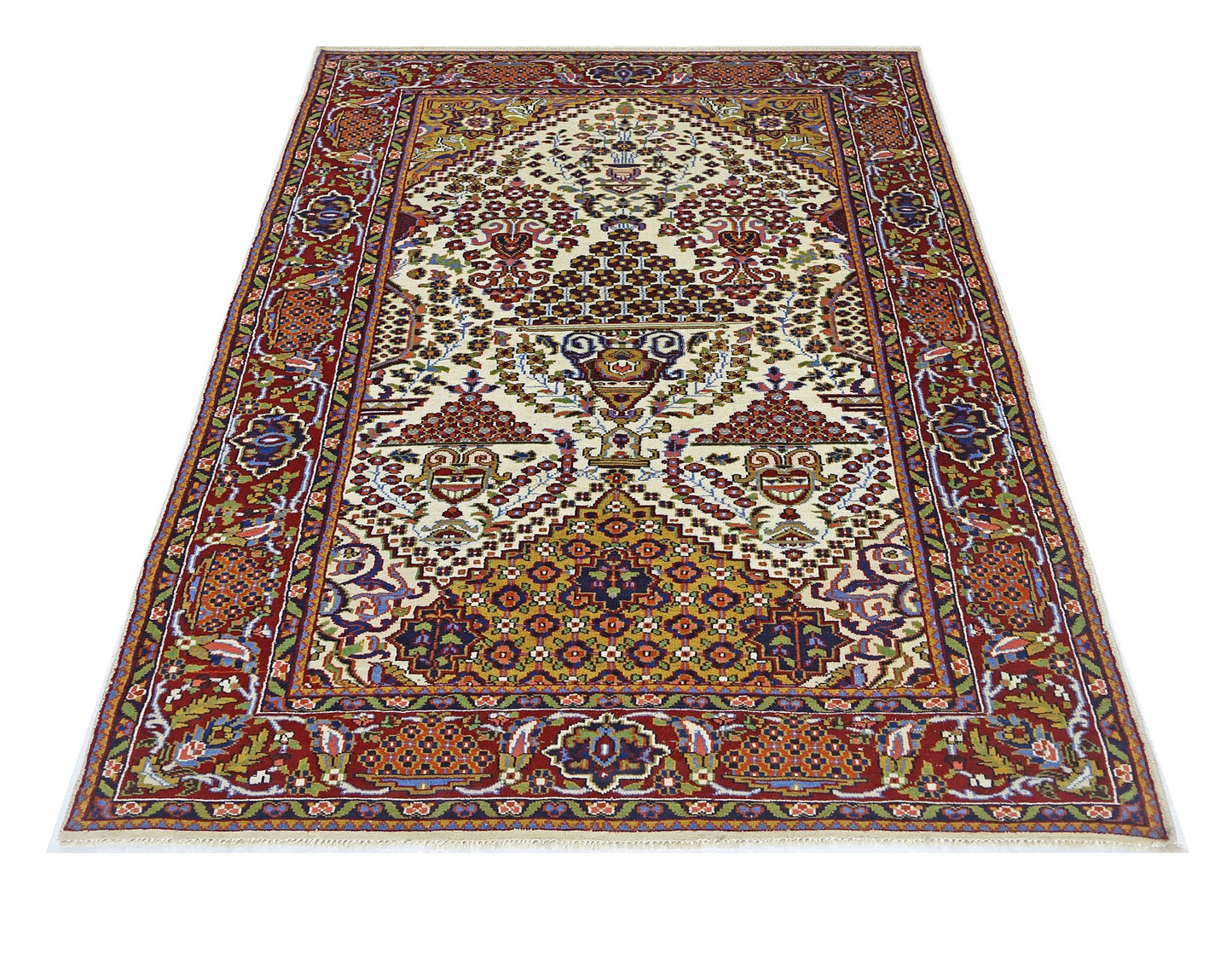 A rectangular vintage Pakistani rug featuring a traditional floral pattern in red and cream tones.