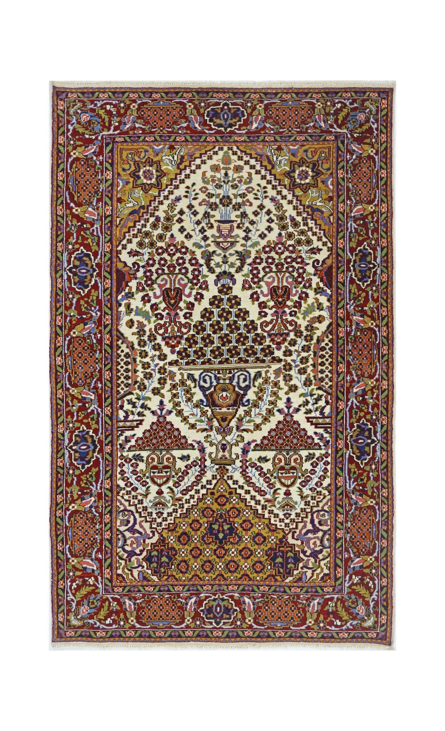 A vintage Pakistani wool rug featuring a central floral vase motif on a cream and gold background.
