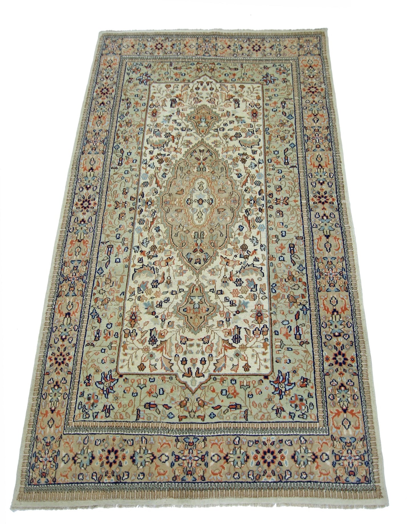 A rectangular vintage Pakistani rug featuring a central medallion on a cream field with floral motifs.