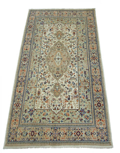 A rectangular vintage Pakistani rug featuring a central medallion on a cream field with floral motifs.
