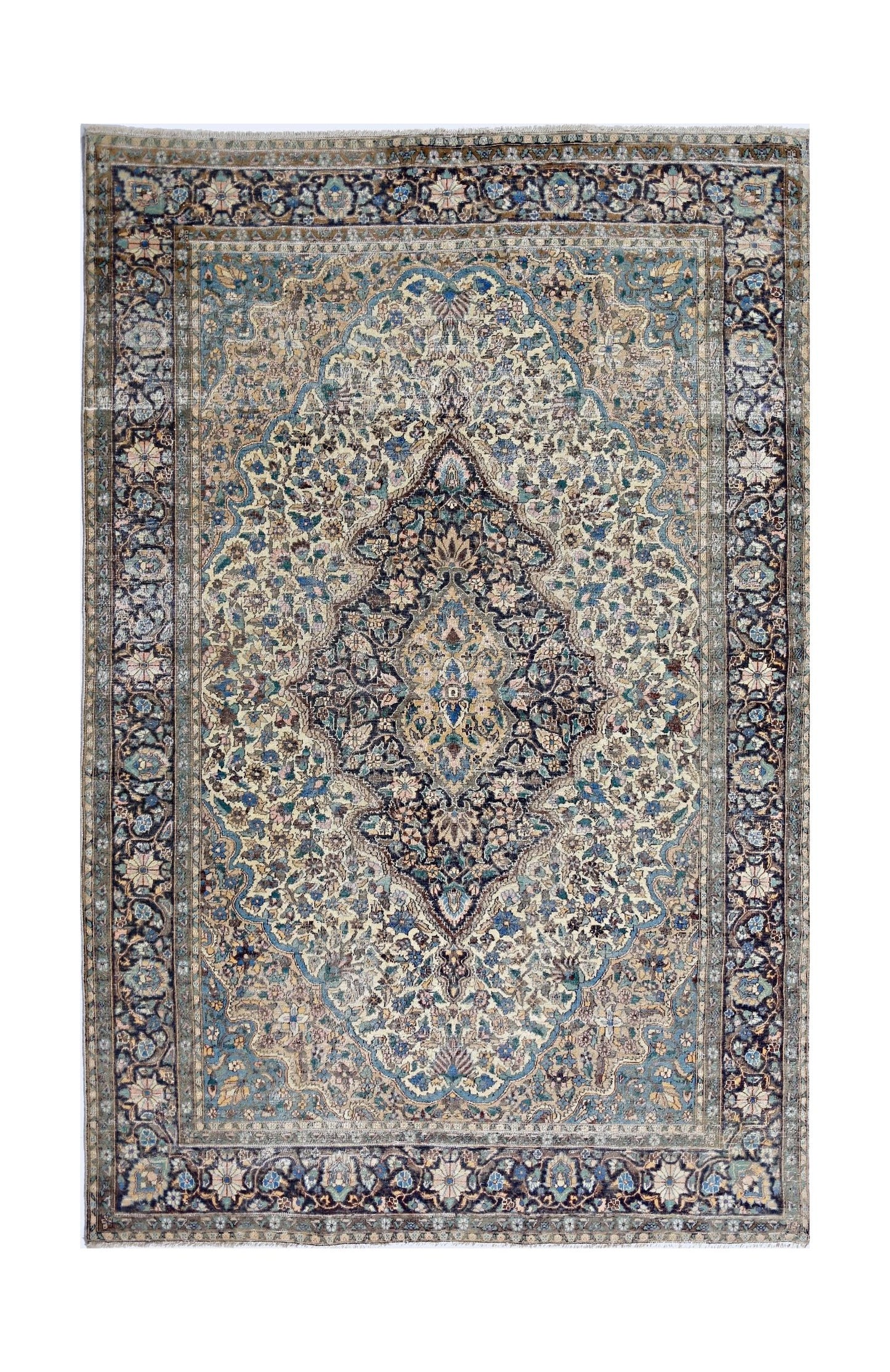 A vintage hand-knotted rug featuring an intricate floral medallion in shades of blue and cream.