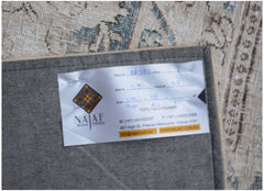 A vintage patchwork rug with a detailed pattern, shown from the back with a product label attached.