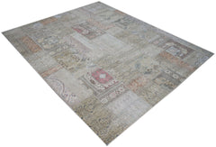 A handmade vintage patchwork rug featuring a faded, multi-patterned design in neutral tones.
