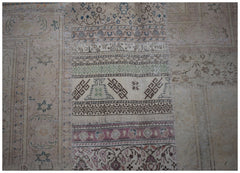 A handmade vintage patchwork rug featuring a variety of intricate geometric and floral patterns.