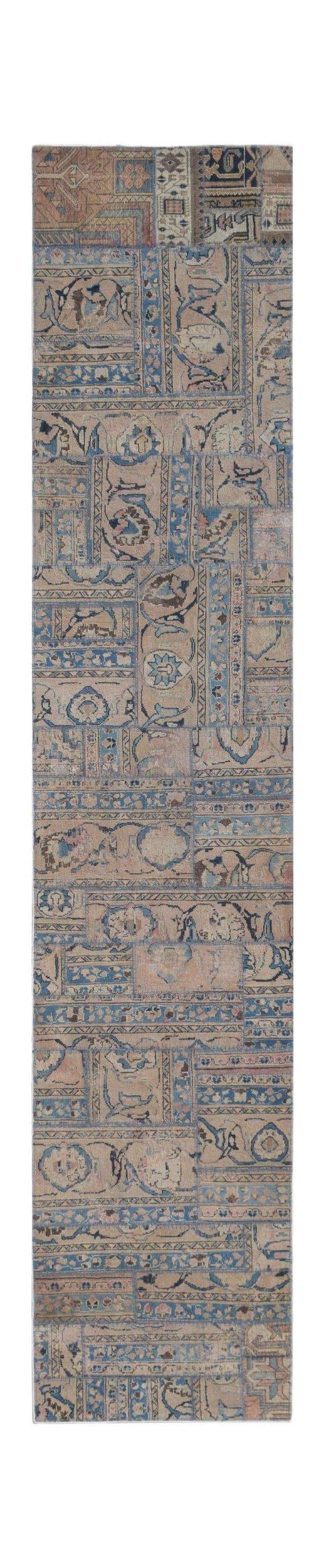 A handmade vintage patchwork runner rug featuring a faded blue and beige geometric pattern.