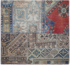A handmade vintage patchwork runner featuring a variety of colorful, patterned wool rug fragments.