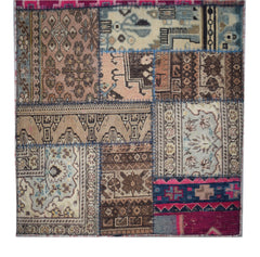A handmade vintage patchwork runner featuring a variety of wool rug fragments in earthy tones.