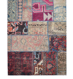 A handmade vintage patchwork runner featuring a vibrant mix of wool rug fragments in various colors.