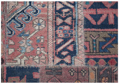 A close-up of a handmade vintage patchwork runner featuring intricate wool patterns in muted tones.