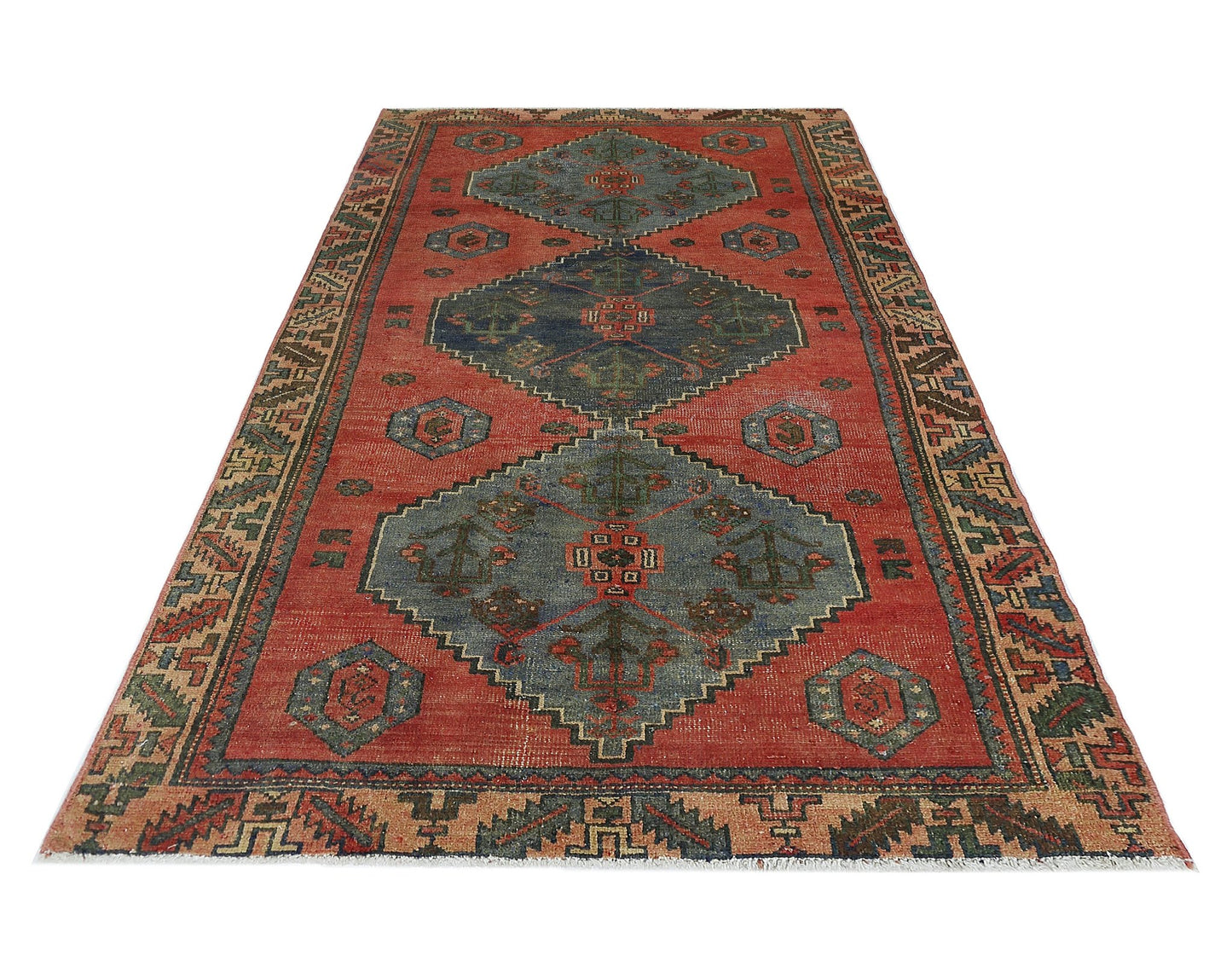 A vintage Persian Afshar rug featuring geometric blue medallions on a red field with patterned borders.