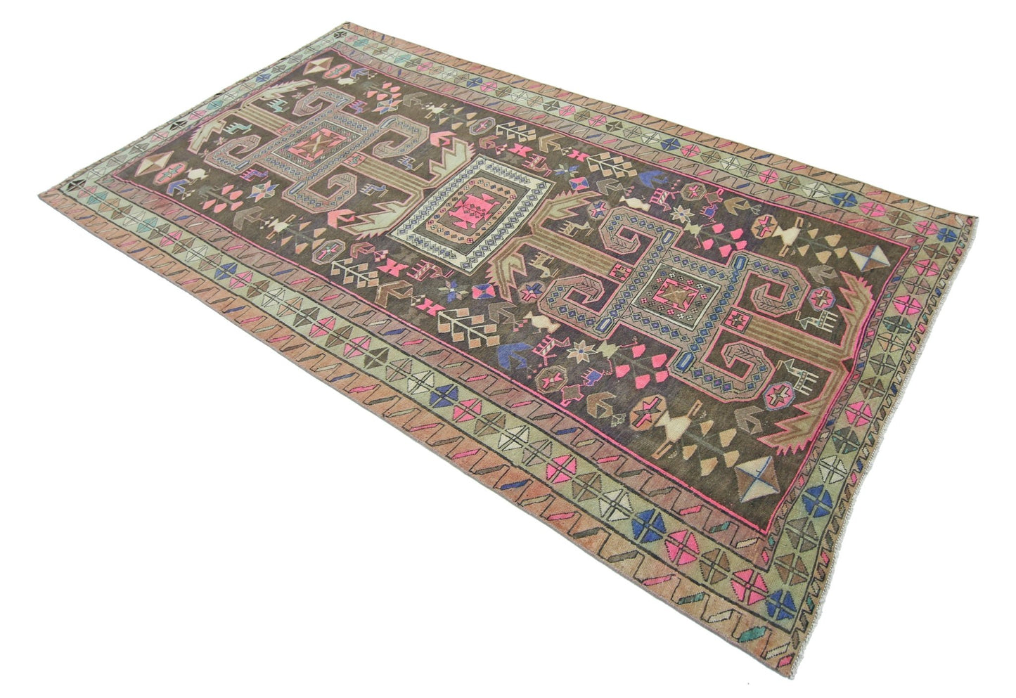 A vintage handmade Persian Ardabil rug featuring geometric patterns in a dark, colorful palette.
