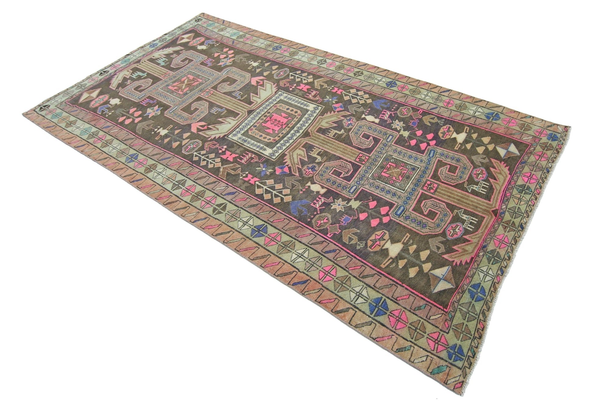 A vintage handmade Persian Ardabil rug featuring geometric patterns in a dark, colorful palette.