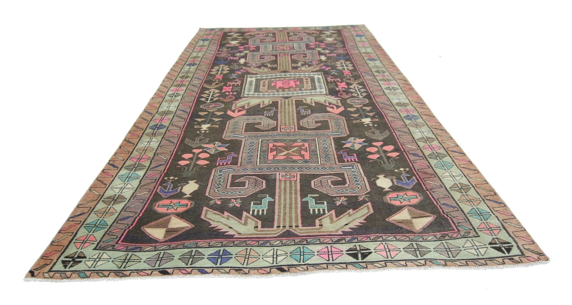 A vintage Persian Ardabil rug featuring geometric patterns and animal motifs in a dark colorway.
