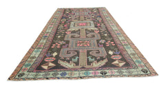 A vintage Persian Ardabil rug featuring geometric patterns and animal motifs in a dark colorway.