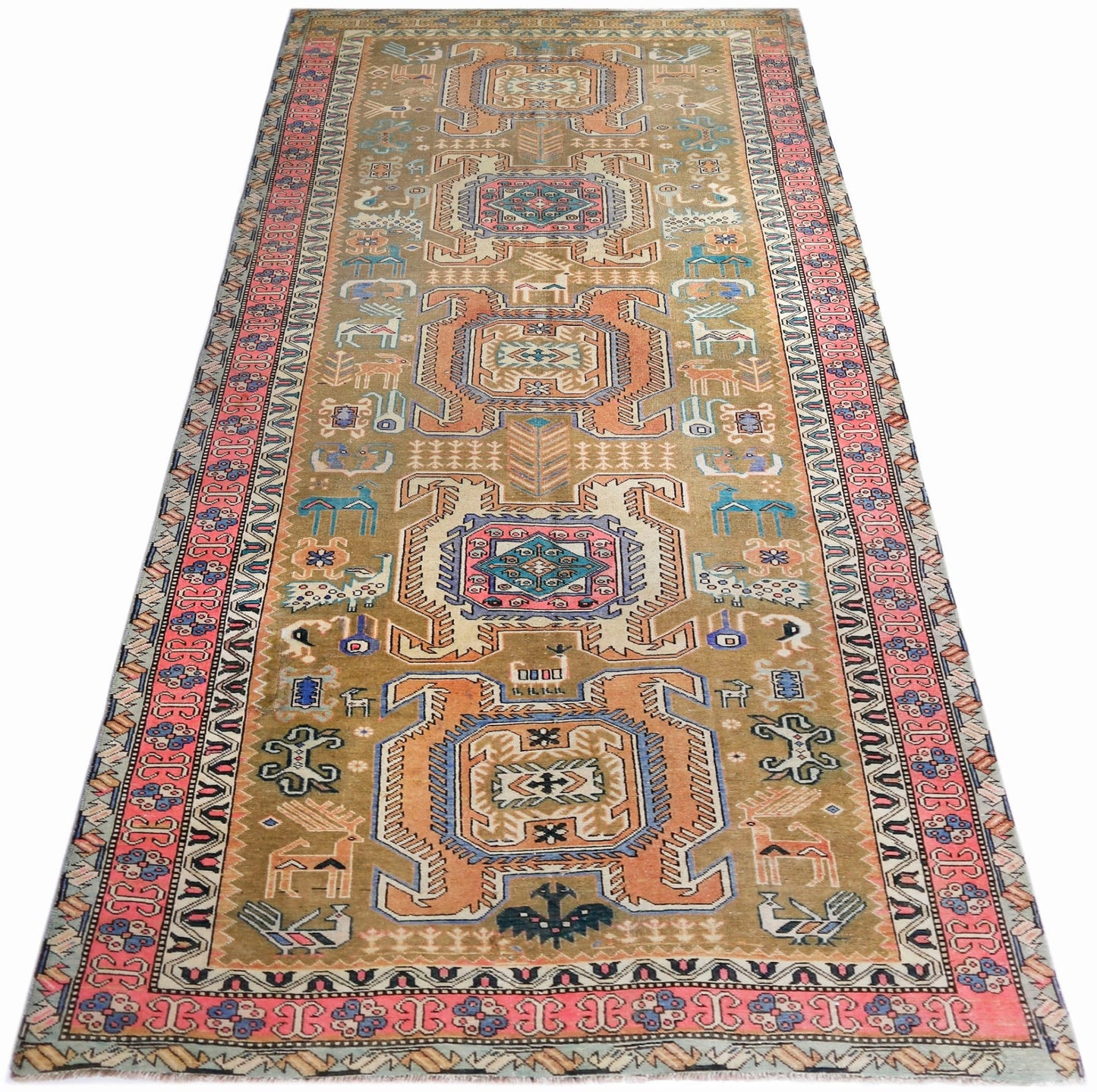 A vintage Persian Ardabil runner rug featuring geometric medallions and animal motifs in tan.