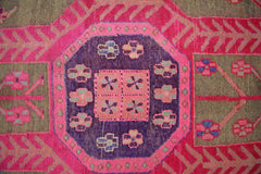 A vintage Persian Ardabil rug featuring a central purple octagon with geometric floral motifs.