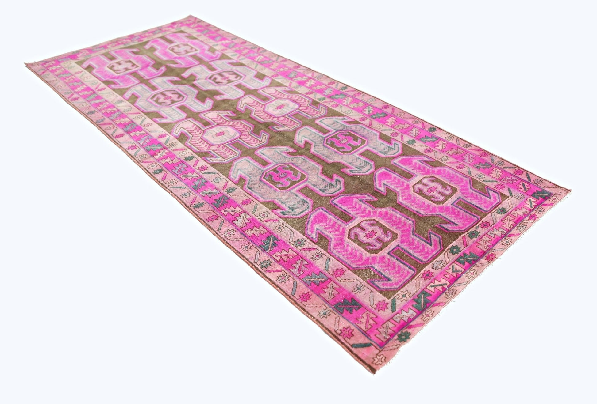 A vintage Persian Ardabil runner featuring geometric patterns in vibrant pink and brown tones.