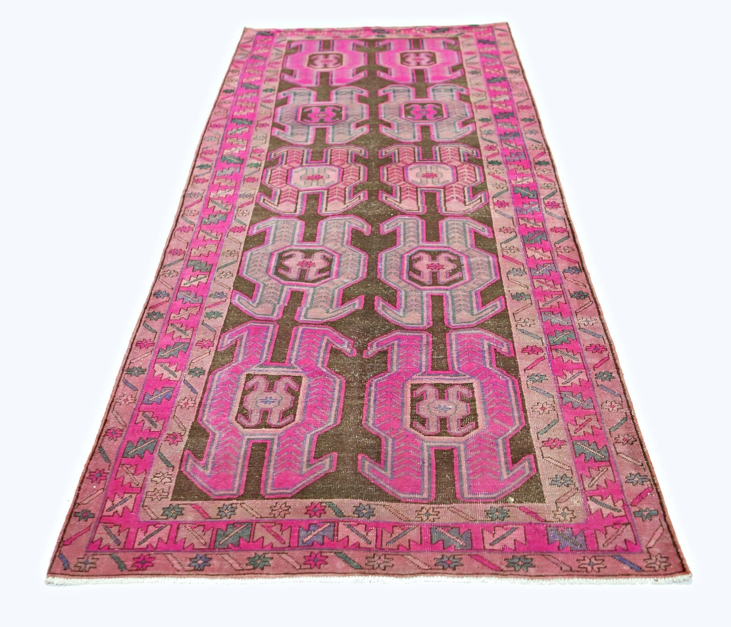 A vintage Persian Ardabil runner featuring a dark brown field with vibrant pink geometric motifs.