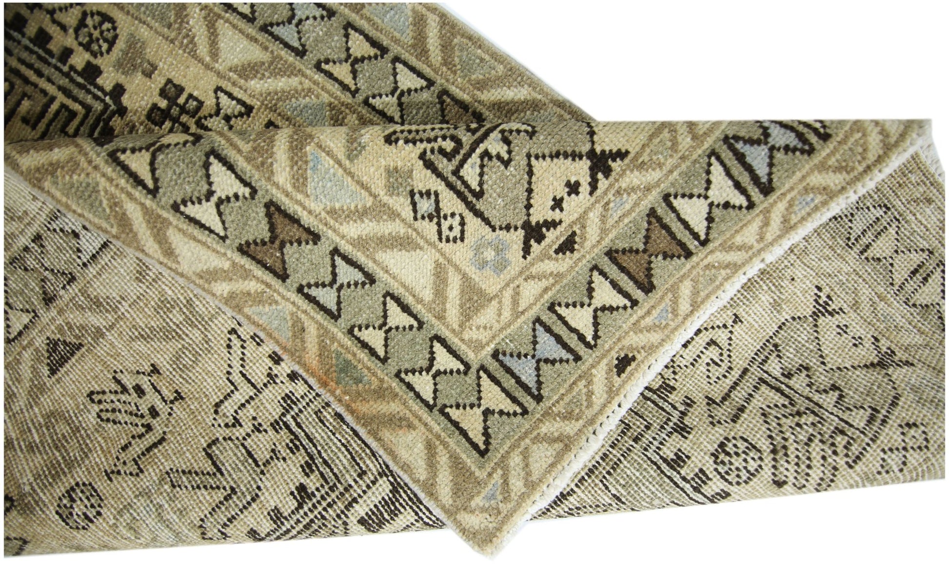 A vintage Persian Ardabil runner featuring a geometric pattern in neutral earth tones.