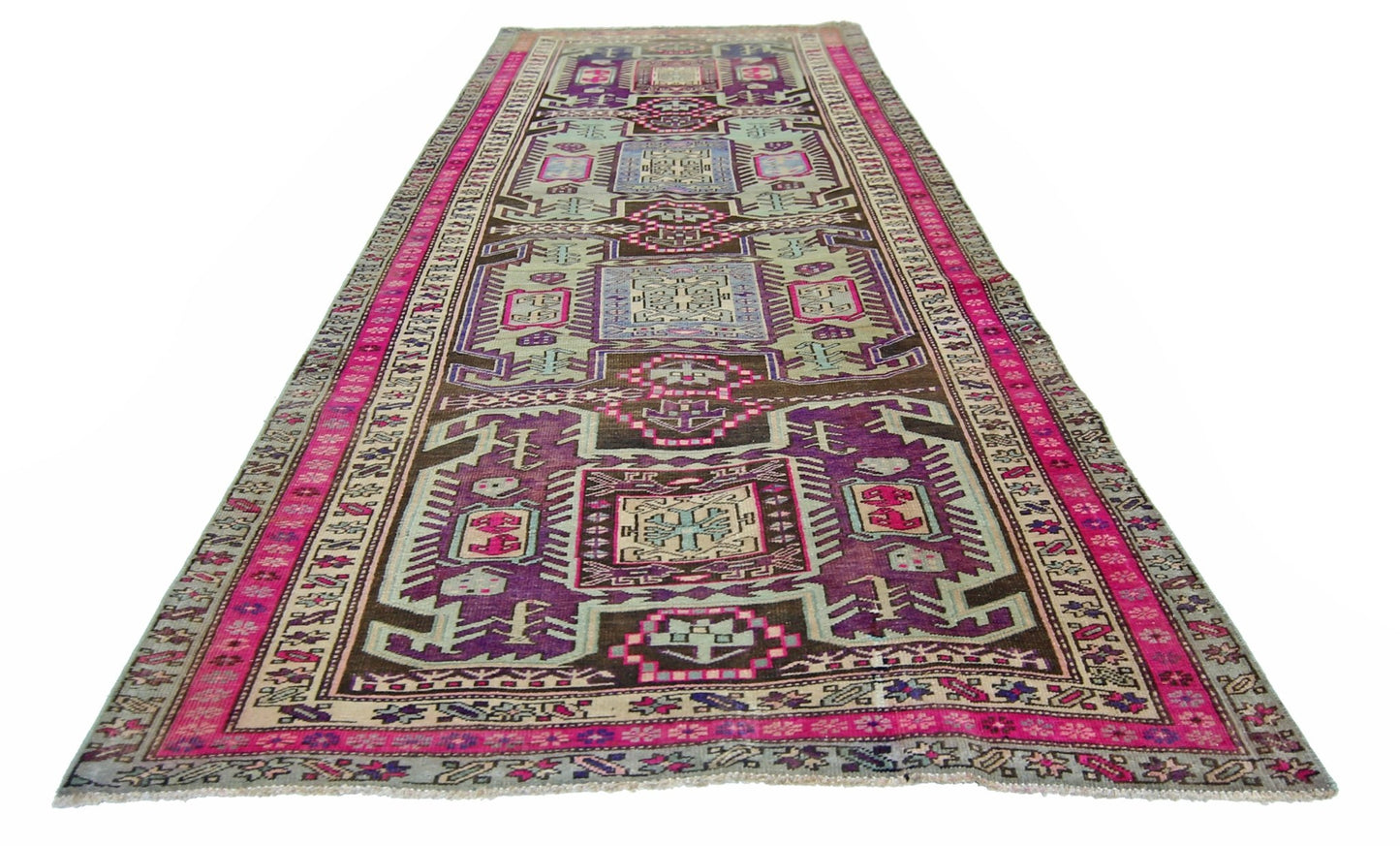 A vintage Persian Ardabil runner featuring a geometric pattern in purple, pink, and blue tones.