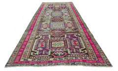 A vintage Persian Ardabil runner featuring a geometric pattern in purple, pink, and blue tones.