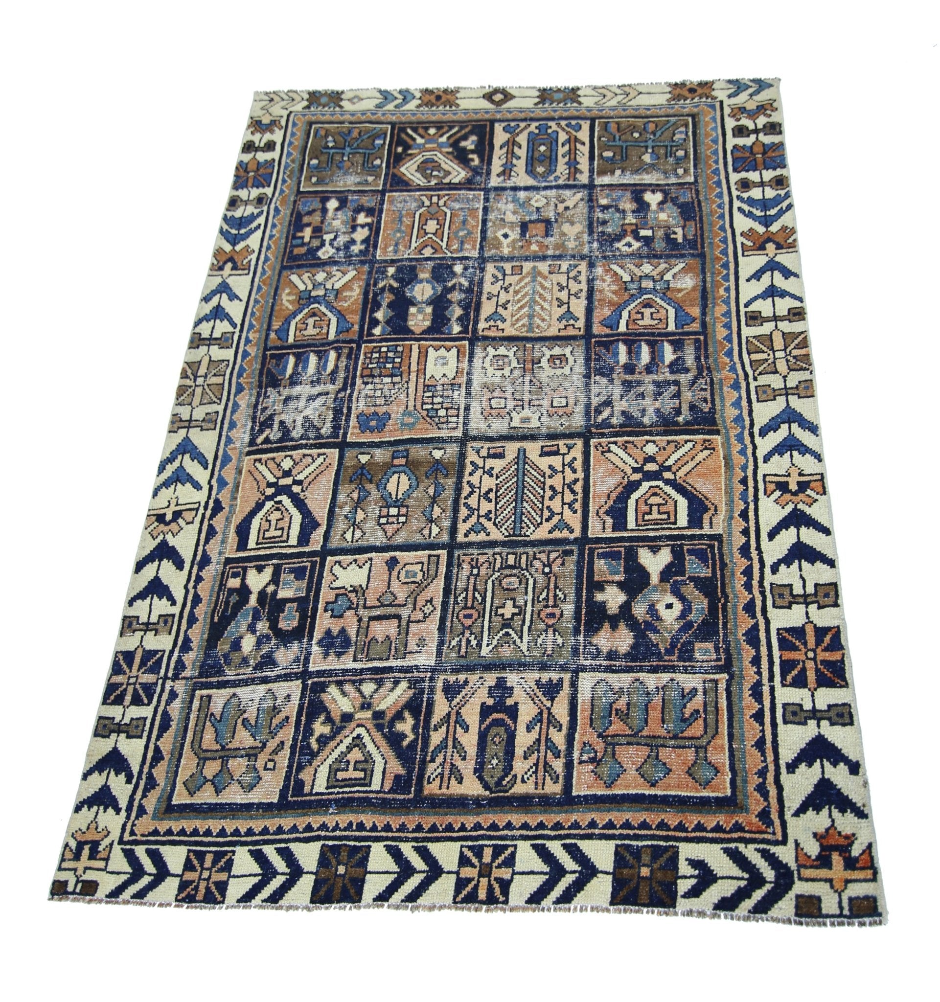 A vintage Persian Bakhtiari rug featuring a grid of geometric and floral motifs in blue and tan.