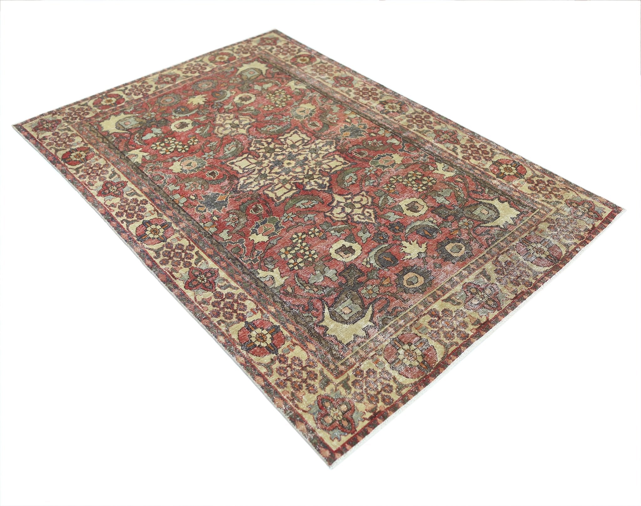 A vintage Persian Bakhtiari rug featuring a traditional floral pattern in red and muted tones.