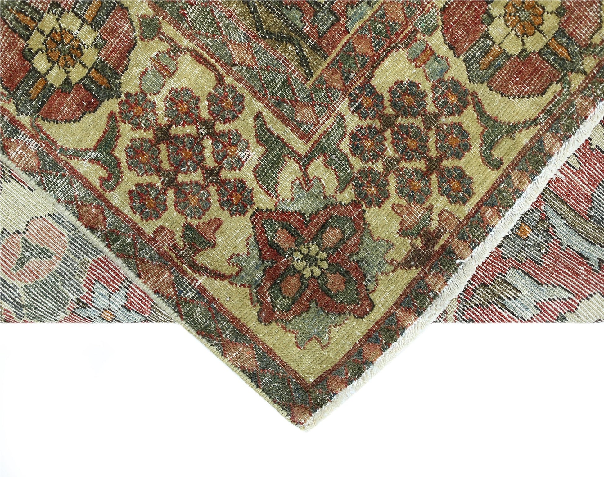 A vintage handmade Persian Bakhtiari rug featuring intricate floral patterns in red and green.
