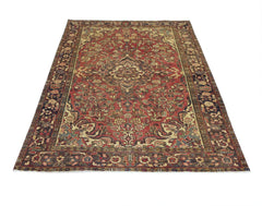 A vintage handmade Persian Bakhtiari rug featuring a floral pattern in red, blue, and cream tones.
