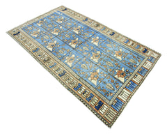 Vintage Persian Bakhtiari rug with a blue Khesti garden panel pattern, floral motifs, and a detailed geometric border.