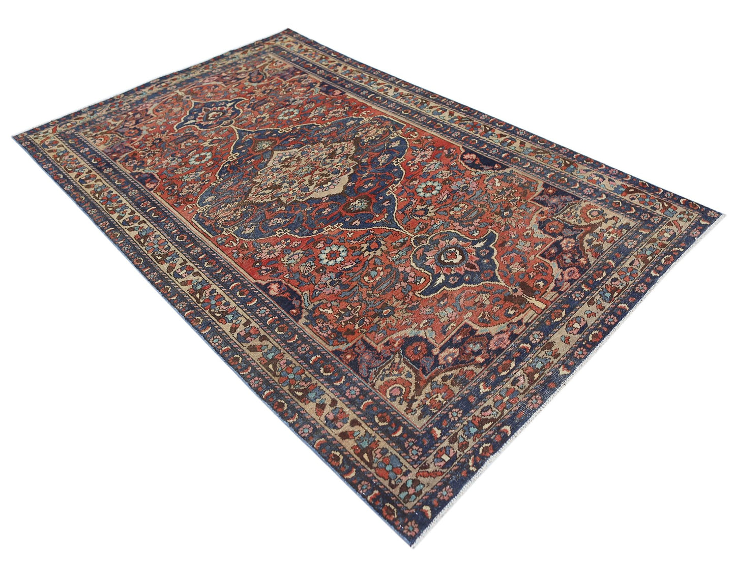 A vintage handmade Persian Bakhtiari rug featuring a traditional floral pattern in red and blue.