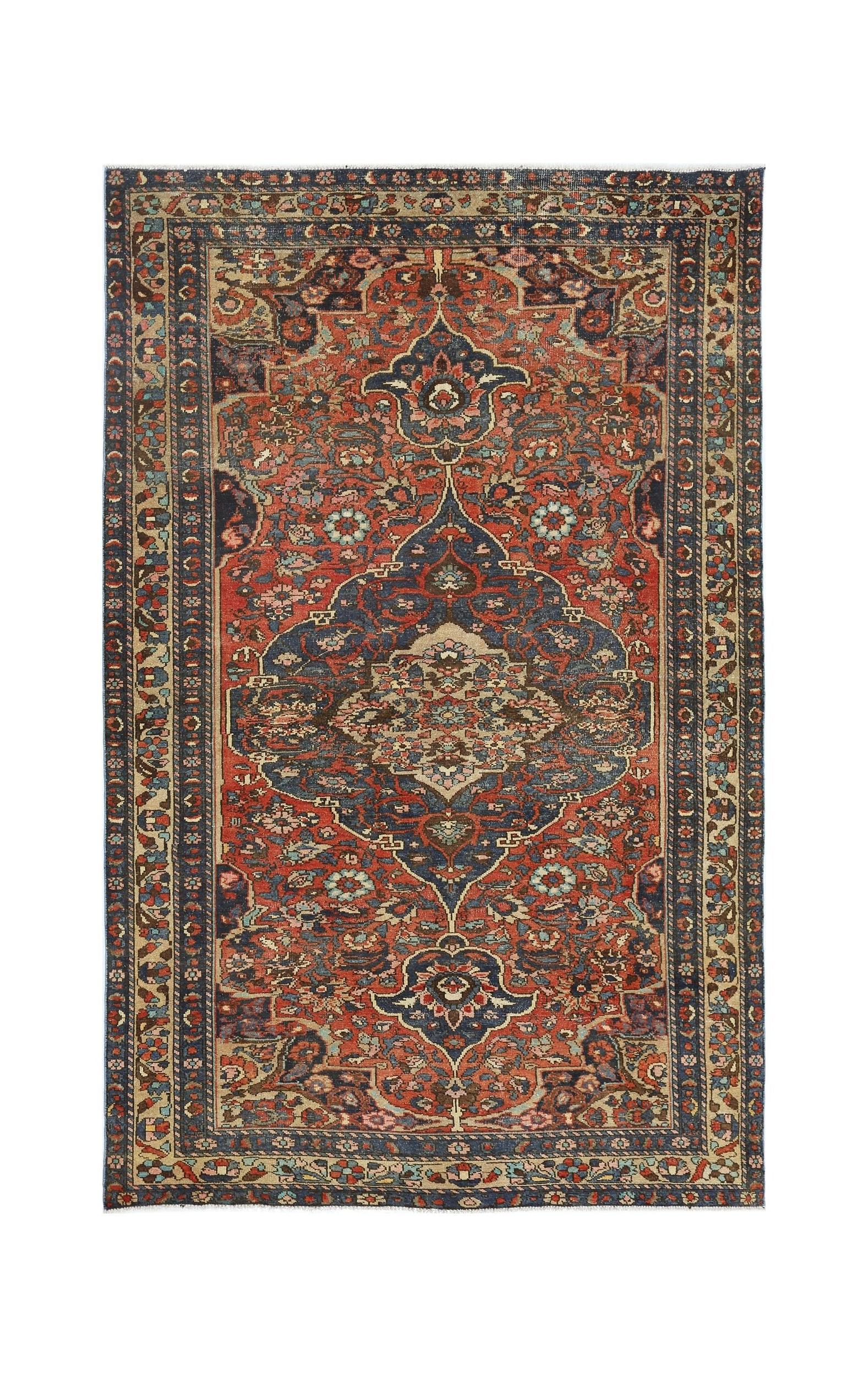 A vintage Persian Bakhtiari rug featuring a central floral medallion on a red and blue field.
