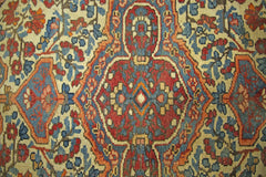 A vintage Persian Bakhtiari rug featuring a geometric floral pattern in red, blue, and cream.