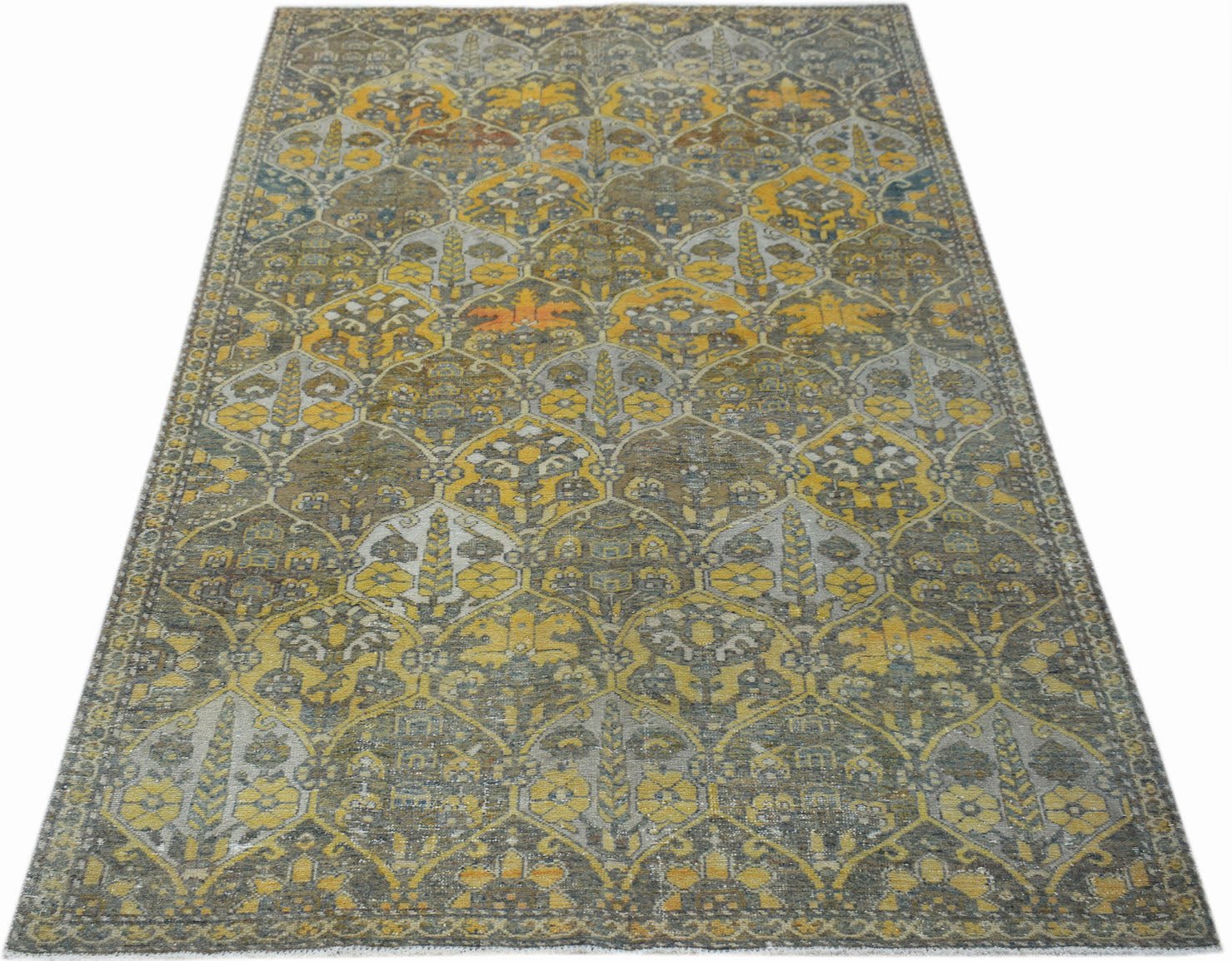 Vintage Persian Bakhtiari rug featuring a repeating floral pattern in yellow, grey, and brown.