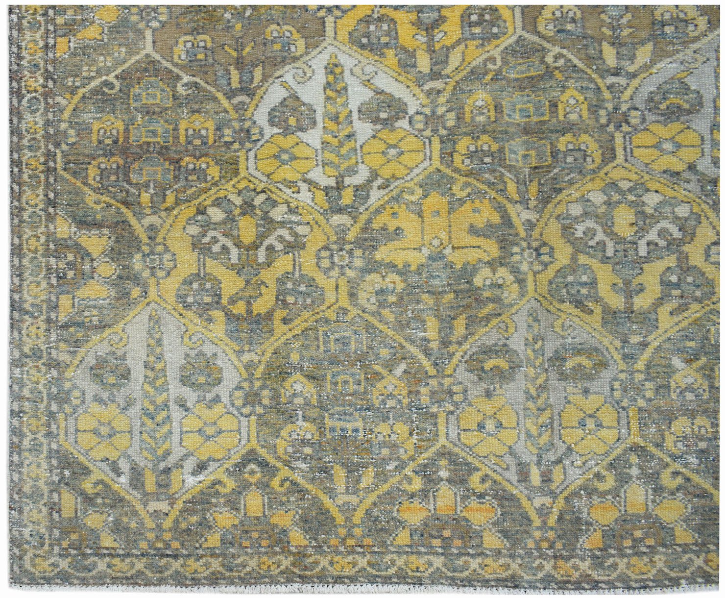 A vintage Persian Bakhtiari rug featuring a repeating geometric garden pattern in yellow and grey.
