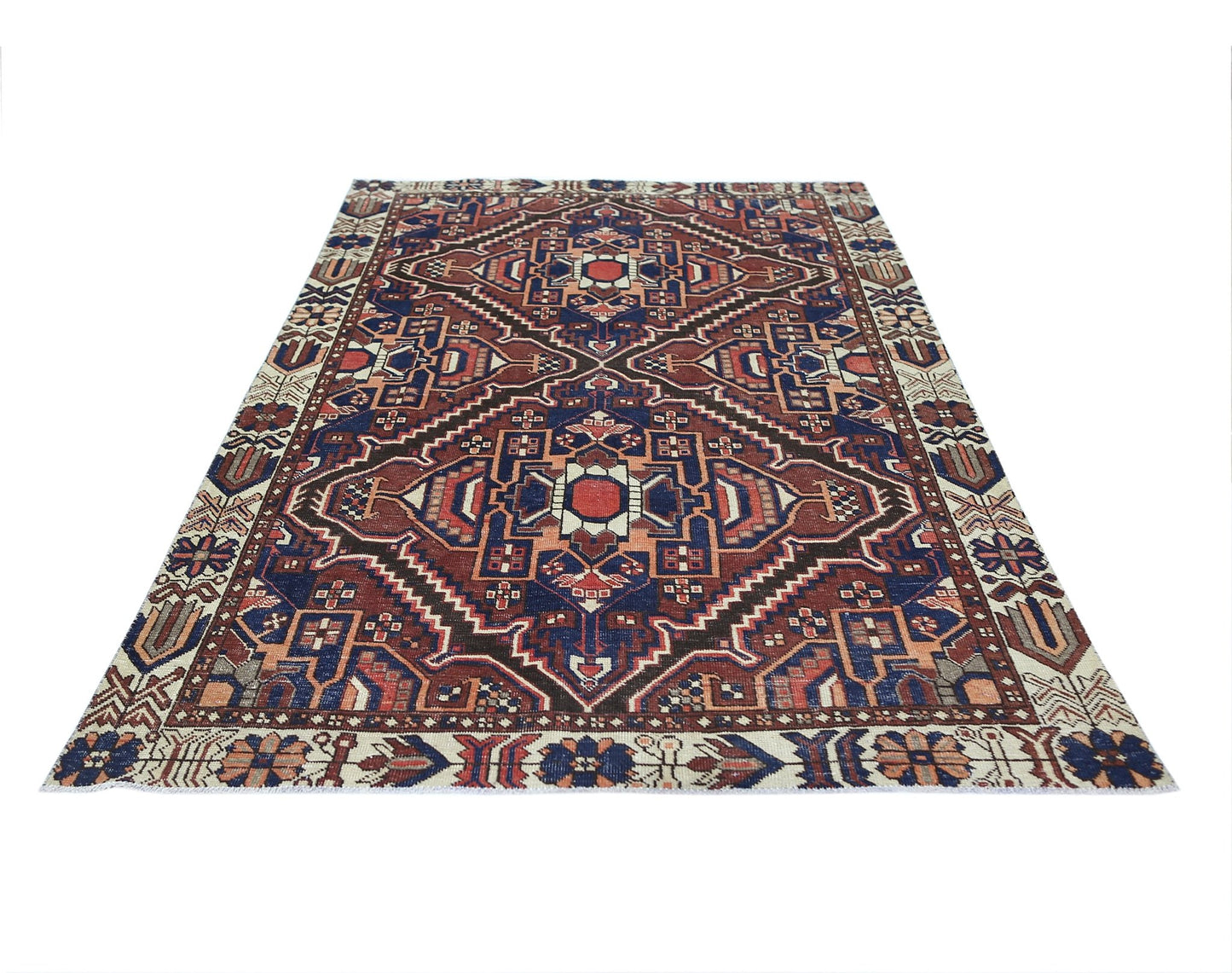 A vintage Persian Bakhtiari rug featuring a geometric medallion pattern in red, blue, and cream.