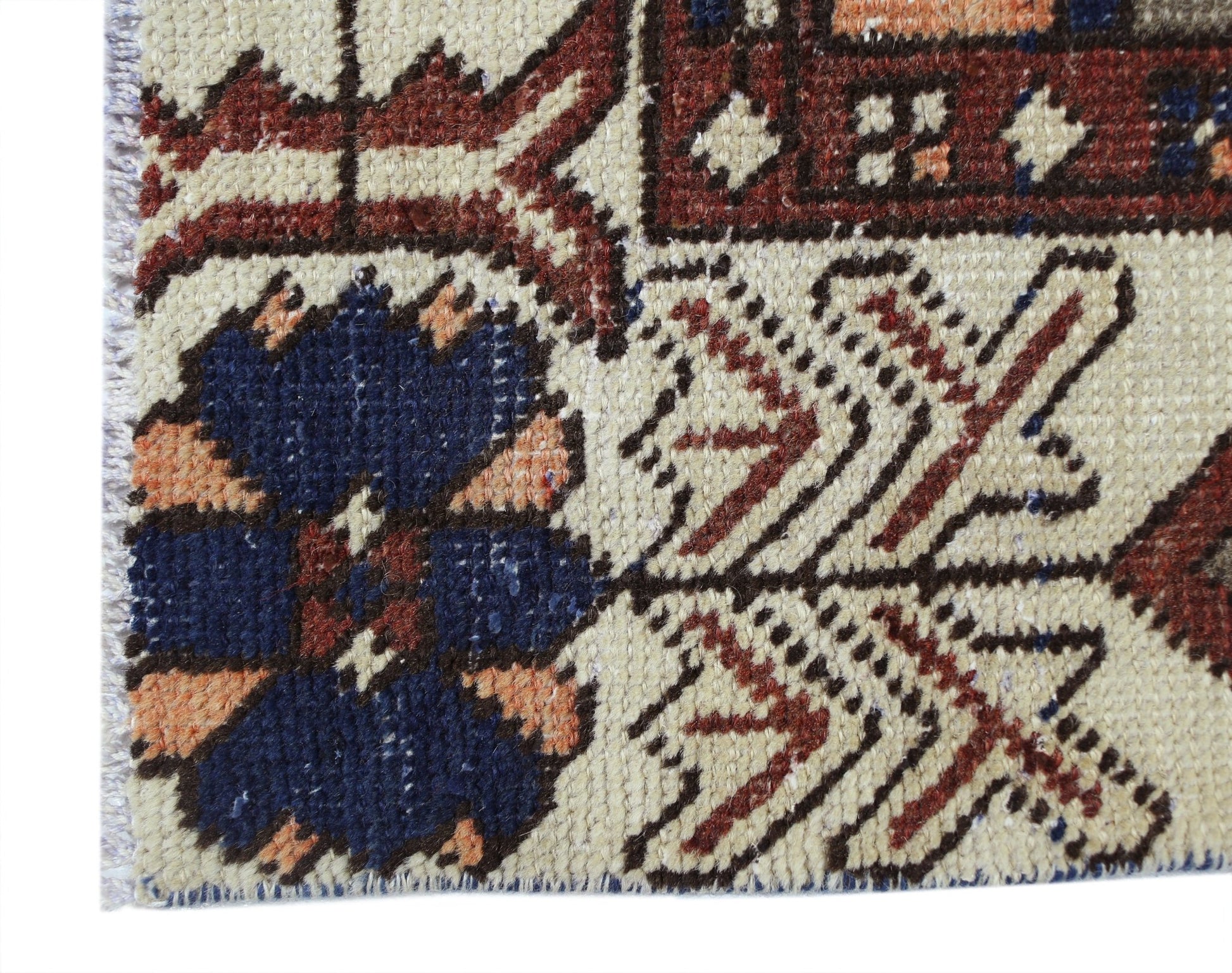 A close-up of a vintage Persian Bakhtiari rug featuring intricate floral patterns in wool.