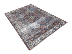 A vintage Persian Bakhtiari rug featuring a distressed, multi-colored geometric pattern.