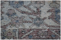 A close-up view of a vintage Persian Bakhtiari rug featuring intricate handwoven wool patterns.