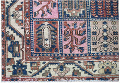 A vintage Persian Bakhtiari rug featuring a colorful geometric panel design in wool.